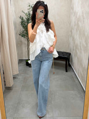 Top a volant blanc avec fleurs