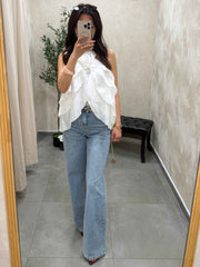 Top a volant blanc avec fleurs
