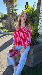 Blusa rosa brillante a rayas